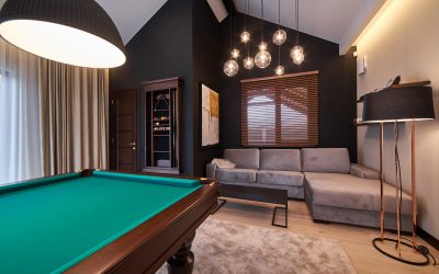 modern billiard room with a beautiful table and large windows